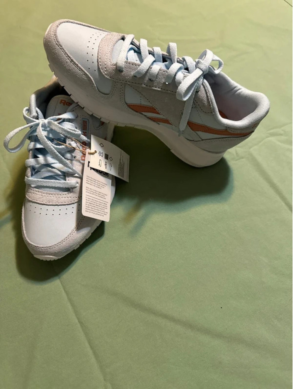 Women’s size 7 Reebok’s light blue and peach